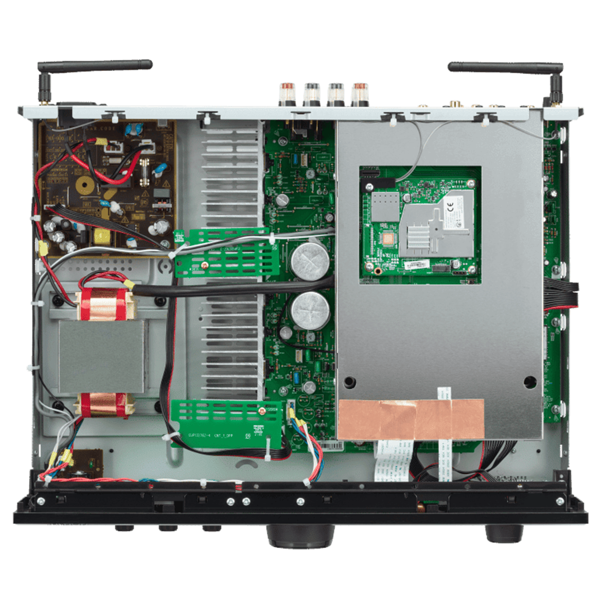 The EI type laminated transformer (left) is away from the digital circuitry protected by a metal case.